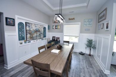 This beautifully landscaped property is situated directly on the on Wild Wing Plantation in South Carolina - for sale on GolfHomes.com, golf home, golf lot