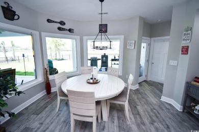 This beautifully landscaped property is situated directly on the on Wild Wing Plantation in South Carolina - for sale on GolfHomes.com, golf home, golf lot