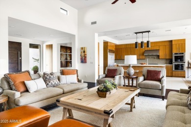 As you enter, you're greeted by soaring ceilings and walls of on Desert Mountain Golf Club - Renegade Course in Arizona - for sale on GolfHomes.com, golf home, golf lot