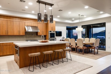 As you enter, you're greeted by soaring ceilings and walls of on Desert Mountain Golf Club - Renegade Course in Arizona - for sale on GolfHomes.com, golf home, golf lot