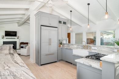 This stunning soundfront home in Pine Knoll Shores has been on The Country Club of the Crystal Coast in North Carolina - for sale on GolfHomes.com, golf home, golf lot