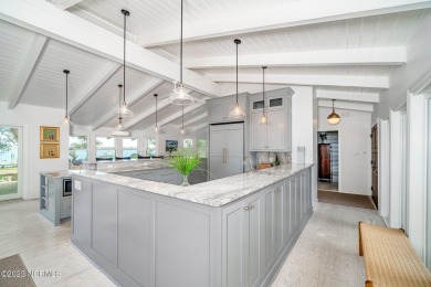 This stunning soundfront home in Pine Knoll Shores has been on The Country Club of the Crystal Coast in North Carolina - for sale on GolfHomes.com, golf home, golf lot