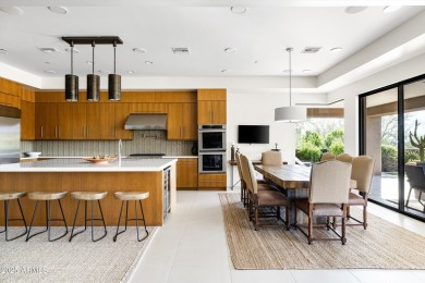 As you enter, you're greeted by soaring ceilings and walls of on Desert Mountain Golf Club - Renegade Course in Arizona - for sale on GolfHomes.com, golf home, golf lot