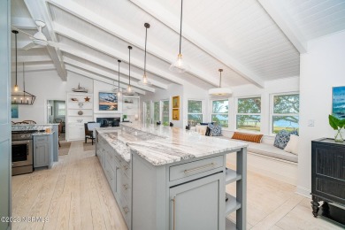 This stunning soundfront home in Pine Knoll Shores has been on The Country Club of the Crystal Coast in North Carolina - for sale on GolfHomes.com, golf home, golf lot