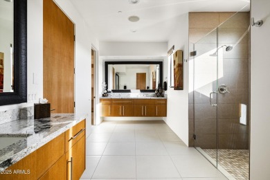 As you enter, you're greeted by soaring ceilings and walls of on Desert Mountain Golf Club - Renegade Course in Arizona - for sale on GolfHomes.com, golf home, golf lot