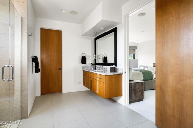 As you enter, you're greeted by soaring ceilings and walls of on Desert Mountain Golf Club - Renegade Course in Arizona - for sale on GolfHomes.com, golf home, golf lot