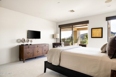 As you enter, you're greeted by soaring ceilings and walls of on Desert Mountain Golf Club - Renegade Course in Arizona - for sale on GolfHomes.com, golf home, golf lot