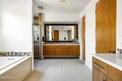 As you enter, you're greeted by soaring ceilings and walls of on Desert Mountain Golf Club - Renegade Course in Arizona - for sale on GolfHomes.com, golf home, golf lot