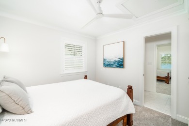 This stunning soundfront home in Pine Knoll Shores has been on The Country Club of the Crystal Coast in North Carolina - for sale on GolfHomes.com, golf home, golf lot