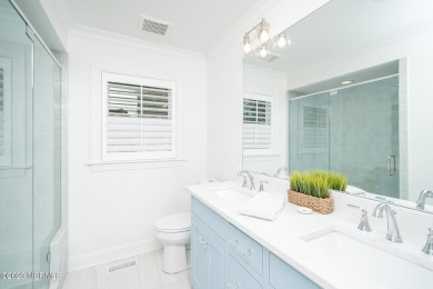This stunning soundfront home in Pine Knoll Shores has been on The Country Club of the Crystal Coast in North Carolina - for sale on GolfHomes.com, golf home, golf lot