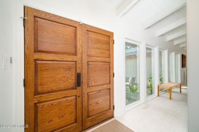 This stunning soundfront home in Pine Knoll Shores has been on The Country Club of the Crystal Coast in North Carolina - for sale on GolfHomes.com, golf home, golf lot