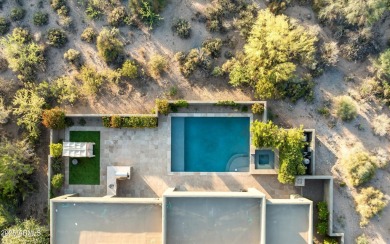 As you enter, you're greeted by soaring ceilings and walls of on Desert Mountain Golf Club - Renegade Course in Arizona - for sale on GolfHomes.com, golf home, golf lot
