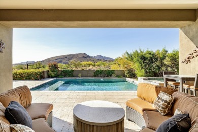 As you enter, you're greeted by soaring ceilings and walls of on Desert Mountain Golf Club - Renegade Course in Arizona - for sale on GolfHomes.com, golf home, golf lot