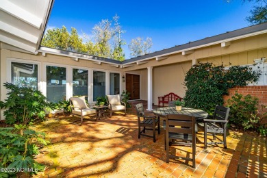 This stunning soundfront home in Pine Knoll Shores has been on The Country Club of the Crystal Coast in North Carolina - for sale on GolfHomes.com, golf home, golf lot