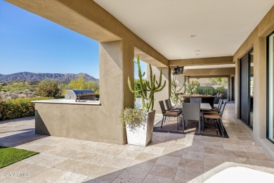 As you enter, you're greeted by soaring ceilings and walls of on Desert Mountain Golf Club - Renegade Course in Arizona - for sale on GolfHomes.com, golf home, golf lot