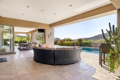 As you enter, you're greeted by soaring ceilings and walls of on Desert Mountain Golf Club - Renegade Course in Arizona - for sale on GolfHomes.com, golf home, golf lot