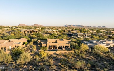 As you enter, you're greeted by soaring ceilings and walls of on Desert Mountain Golf Club - Renegade Course in Arizona - for sale on GolfHomes.com, golf home, golf lot