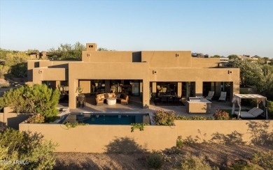 As you enter, you're greeted by soaring ceilings and walls of on Desert Mountain Golf Club - Renegade Course in Arizona - for sale on GolfHomes.com, golf home, golf lot