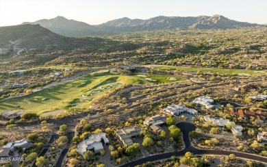 As you enter, you're greeted by soaring ceilings and walls of on Desert Mountain Golf Club - Renegade Course in Arizona - for sale on GolfHomes.com, golf home, golf lot