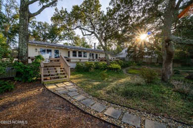 This stunning soundfront home in Pine Knoll Shores has been on The Country Club of the Crystal Coast in North Carolina - for sale on GolfHomes.com, golf home, golf lot
