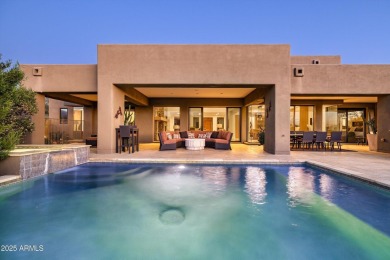 As you enter, you're greeted by soaring ceilings and walls of on Desert Mountain Golf Club - Renegade Course in Arizona - for sale on GolfHomes.com, golf home, golf lot