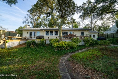 This stunning soundfront home in Pine Knoll Shores has been on The Country Club of the Crystal Coast in North Carolina - for sale on GolfHomes.com, golf home, golf lot