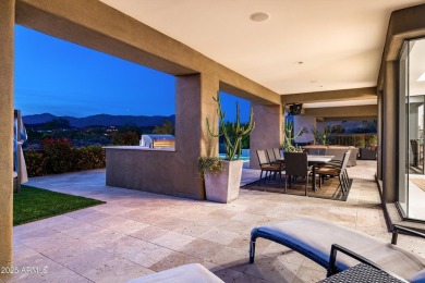 As you enter, you're greeted by soaring ceilings and walls of on Desert Mountain Golf Club - Renegade Course in Arizona - for sale on GolfHomes.com, golf home, golf lot