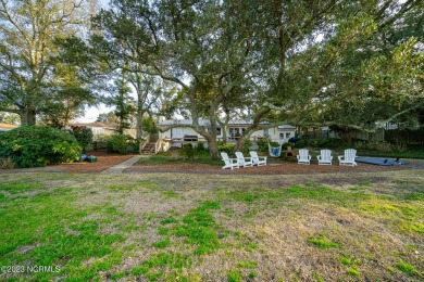 This stunning soundfront home in Pine Knoll Shores has been on The Country Club of the Crystal Coast in North Carolina - for sale on GolfHomes.com, golf home, golf lot