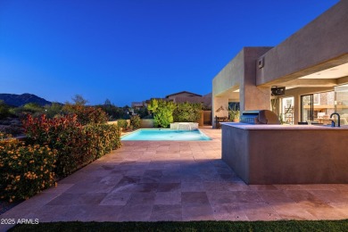 As you enter, you're greeted by soaring ceilings and walls of on Desert Mountain Golf Club - Renegade Course in Arizona - for sale on GolfHomes.com, golf home, golf lot