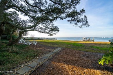 This stunning soundfront home in Pine Knoll Shores has been on The Country Club of the Crystal Coast in North Carolina - for sale on GolfHomes.com, golf home, golf lot