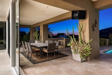 As you enter, you're greeted by soaring ceilings and walls of on Desert Mountain Golf Club - Renegade Course in Arizona - for sale on GolfHomes.com, golf home, golf lot