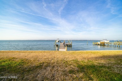 This stunning soundfront home in Pine Knoll Shores has been on The Country Club of the Crystal Coast in North Carolina - for sale on GolfHomes.com, golf home, golf lot