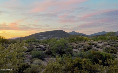 As you enter, you're greeted by soaring ceilings and walls of on Desert Mountain Golf Club - Renegade Course in Arizona - for sale on GolfHomes.com, golf home, golf lot