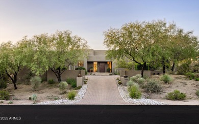 As you enter, you're greeted by soaring ceilings and walls of on Desert Mountain Golf Club - Renegade Course in Arizona - for sale on GolfHomes.com, golf home, golf lot