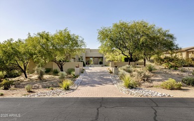 As you enter, you're greeted by soaring ceilings and walls of on Desert Mountain Golf Club - Renegade Course in Arizona - for sale on GolfHomes.com, golf home, golf lot