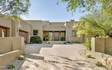 As you enter, you're greeted by soaring ceilings and walls of on Desert Mountain Golf Club - Renegade Course in Arizona - for sale on GolfHomes.com, golf home, golf lot