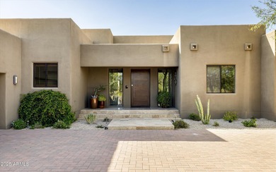 As you enter, you're greeted by soaring ceilings and walls of on Desert Mountain Golf Club - Renegade Course in Arizona - for sale on GolfHomes.com, golf home, golf lot