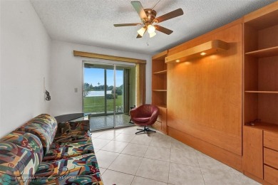 GROUND FLOOR unit with LAKE VIEW located in the desirable on Hillsboro Pines Golf in Florida - for sale on GolfHomes.com, golf home, golf lot