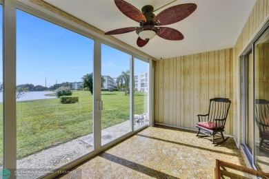 GROUND FLOOR unit with LAKE VIEW located in the desirable on Hillsboro Pines Golf in Florida - for sale on GolfHomes.com, golf home, golf lot