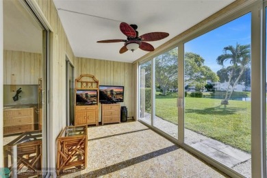 GROUND FLOOR unit with LAKE VIEW located in the desirable on Hillsboro Pines Golf in Florida - for sale on GolfHomes.com, golf home, golf lot