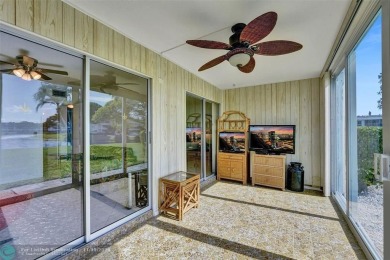 GROUND FLOOR unit with LAKE VIEW located in the desirable on Hillsboro Pines Golf in Florida - for sale on GolfHomes.com, golf home, golf lot