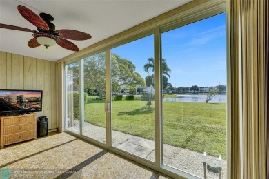 GROUND FLOOR unit with LAKE VIEW located in the desirable on Hillsboro Pines Golf in Florida - for sale on GolfHomes.com, golf home, golf lot