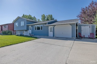 Welcome home to this charming 3 bedroom, 2 bathroom multi-level on Bill Roberts Municipal Golf Course in Montana - for sale on GolfHomes.com, golf home, golf lot