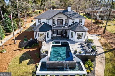 Welcome to this stunning lakefront home in the gated community on The Golf Club at Cuscowilla in Georgia - for sale on GolfHomes.com, golf home, golf lot