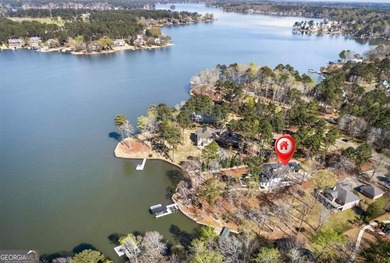 Welcome to this stunning lakefront home in the gated community on The Golf Club at Cuscowilla in Georgia - for sale on GolfHomes.com, golf home, golf lot