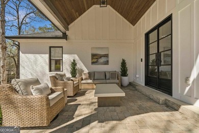 Welcome to this stunning lakefront home in the gated community on The Golf Club at Cuscowilla in Georgia - for sale on GolfHomes.com, golf home, golf lot