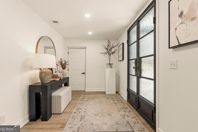 Welcome to this stunning lakefront home in the gated community on The Golf Club at Cuscowilla in Georgia - for sale on GolfHomes.com, golf home, golf lot