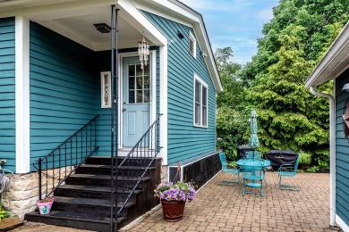 Step into timeless charm with this stunning Folk Victorian home on Harmon Golf Club in Ohio - for sale on GolfHomes.com, golf home, golf lot