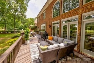 This exquisite brick residence located in Providence Country on Providence Country Club in North Carolina - for sale on GolfHomes.com, golf home, golf lot