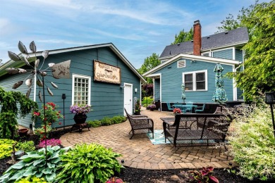 Step into timeless charm with this stunning Folk Victorian home on Harmon Golf Club in Ohio - for sale on GolfHomes.com, golf home, golf lot
